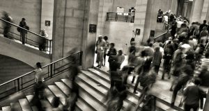 Етички дилеми: Дали AI ќе ги замени нашите работни места? group of people walking on the stairs