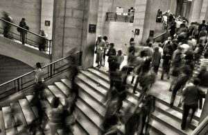 Етички дилеми: Дали AI ќе ги замени нашите работни места? group of people walking on the stairs