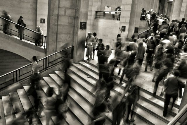 group of people walking on the stairs